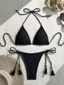 Flat lay of black crochet bikini set with fringe ties, straw hat and sunglasses - S / Black