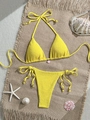 Detailed flat lay of a textured yellow bikini with pink shell charm and sea decor - S / Yellow