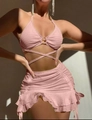 Detail of pink halter bikini with waist crossover straps and ruffled mini skirt - S / Pink