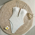 Elegant white lace one-piece swimsuit with amber beads on textured floral crochet fabric - S / Off-white