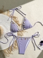 Detail of purple ribbed bikini with seashell and starfish charms on a beach setting - S / Purple