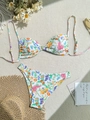 Floral print two-piece bikini set with ribbed fabric and adjustable straps on flat lay - S / White