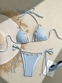 Close-up of light blue bikini with sea shells and starfish details on textured fabric - S / Top And Bottom / Blue