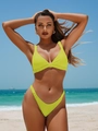 Detail of neon yellow bikini set with V-neck pleats and high-cut leg on a sunny beach - S / Yellow