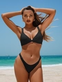 Detail of a black split bikini set with ruched design and thick straps on a sunny beach - S / Black