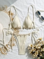 Chic cream ribbed shell-accented bikini set on beach fabric with summer accessories - S / Beige