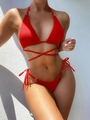 Red textured bikini set with metal ring details and halter neck wrap-around waist ties - Red