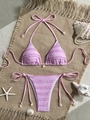 Flat lay of pink smocked bikini with ruffled edges and decorative sea shells on mat - S / Pink