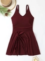 Flat lay of wine red plus size one-piece swimsuit with V-neck and ruched waist detail - Burgundy