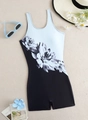 Flat lay of a floral print one-piece swimsuit with black boy shorts and summer accessories - S / Black and White Print