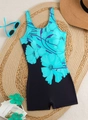 Detailed flat lay of a sporty one-piece swimsuit with floral patterns on a woven mat - S / Turquoise Floral