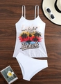 Flat lay of white two-piece bikini featuring tropical palm tree print on a wood background - S / White