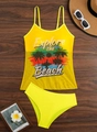 Flat lay detail of yellow tankini set with tropical print on a wooden background - S / Yellow