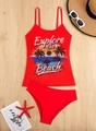 Flat lay of red two-piece bikini with palm tree print and beach accessories on wood - S / Red