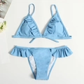 Flat lay of light blue bikini set featuring ruffle trim and halter neck triangle top - Sky Blue