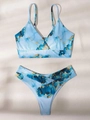 Flat lay of a two-piece bikini featuring blue fluid marble print and crossover V-waist detail - S / 07 Blue