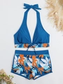Flat lay of tropical two-piece bikini featuring halter top and floral boy-leg swim shorts - S / Blue