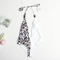 Halter neck one-piece swimsuit featuring asymmetric blue leopard print and white panels - S / Silver White Pattern