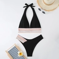 Flat lay of black halter bikini set with rainbow scalloped trim and beach accessories - S / Black