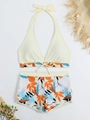 Two-piece halter bikini set with high-waisted shorts and tropical leaf pattern - S / Pale Yellow