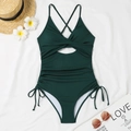 Close-up of dark green ribbed swimsuit with hollow-out knot and drawstring side details - S / Dark Green