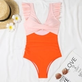Close-up of pink and orange one-piece swimsuit with V-neck twist and ruffle straps - S / Nude Pink + Orange