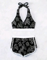 Zweiteiliger Halter-Bikini mit hoch taillierten Shorts und schwarzem Tropen-Print - S / Schwarz