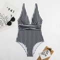 Deep V-neck striped one-piece swimsuit laid flat with sunglasses and magazine - S / Black