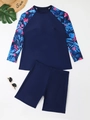 Close-up of long sleeve rash guard with tropical floral print and matching navy boyshorts - 1XL / Navy Blue
