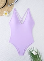 Close-up of lavender one-piece swimsuit with V-neckline and tropical vacation accessories - S / Light Purple