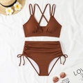 Detailed flat lay of ribbed caramel bikini with drawstring high waist and resort props - S / Brown