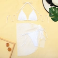 Flat lay of a white three-piece bikini set with a mesh skirt and beach accessories - S / White