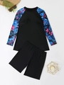 Flat lay of long sleeve tankini top with tropical leaf print and black swim shorts - 1XL / Black