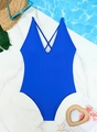 Deep V-neck royal blue one-piece swimsuit with cross-back straps on water background - S / Blue