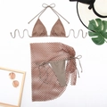 Detailed flat lay of three-piece coffee mesh bikini set with cover-up skirt and summer decor - S / Brown
