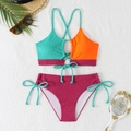 Flat lay of a ribbed color-block bikini set with textured fabric and summer accessories - S / Sky Blue And Orange