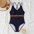 Detail of navy one-piece swimsuit with cross straps and geometric embroidery trim - S / Navy Blue