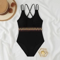 Close-up of black one-piece swimsuit with ethnic embroidery on a beach setup - S / Black