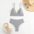 Flat lay of high-waisted striped bikini set with summer accessories on white background - S / Black