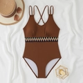 Detailed macro view of brown ribbed swimsuit fabric and ethnic colorful embroidery - S / Brown