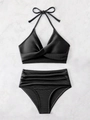 Flat lay of black ribbed bikini set with high-waisted ruched bottoms and twist top - S / Black