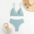Flat lay of green striped high-waisted bikini set with sunglasses and straw bag - S / Green