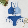 Detailed flat lay of textured color-block bikini with halter cross straps and side ties - S / Blue + Light Blue