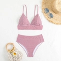 Flat lay of red and white striped high-waisted bikini with summer beach accessories - S / Red