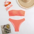 Flat lay of orange strapless bikini with smocked fabric and summer vacation accessories - S / Orange