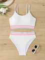 Detailed flat lay of white ribbed bikini with colorful striped elastic waistbands on wood - S / Black