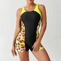 Dettaglio frontale di un costume intero sportivo con blocchi di colore e stampe di palme - S / Giallo