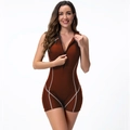 Detail of burgundy one-piece swimsuit with black front zipper and white contrast stitching - Caramel