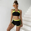 Close-up of sporty two-piece bikini with front zipper and vibrant neon contrast trim - S / Yellow