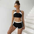 Detail of black sports bikini top with front zipper and contrast white trim detail - S / White